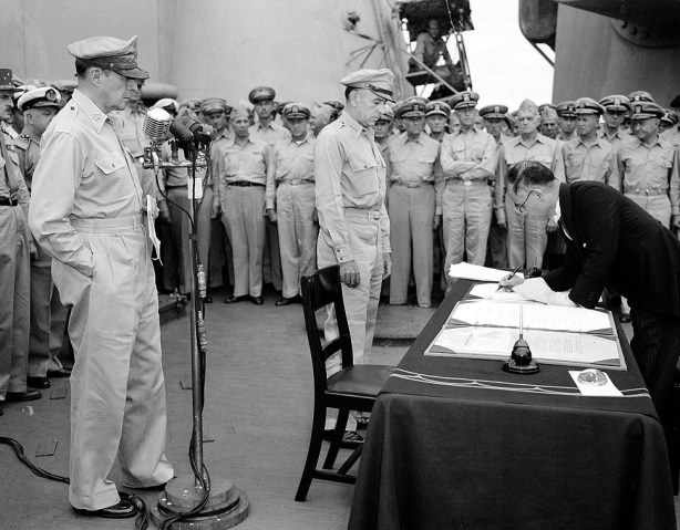 Japan's foreign minister surrenders while MacArthur watches.